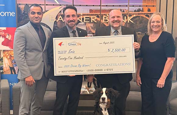 Dream big monthly winner check presentation to Eric