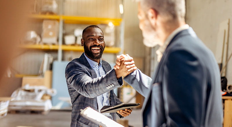 Two people exchanging handshaking