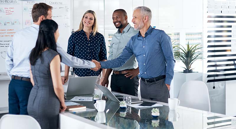New colleagues shaking hands