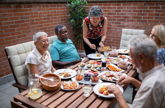 Retirees enjoying dinner together