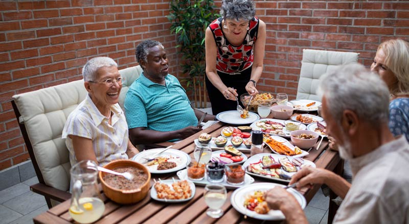 Retirees enjoying dinner together