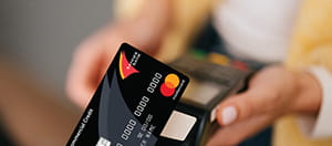 Person using a Commercial Mastercard at a card reader