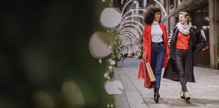 Two women walking down the street