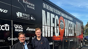 Banner Bank employees with a Manufacturing Week bus