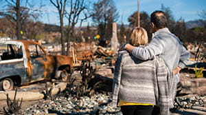Couple looking over wildfire area