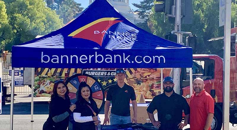 Banner Bank employees with a booth at the Sac Century Challenge