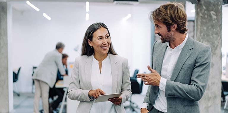 Colleagues in discussion in an office space