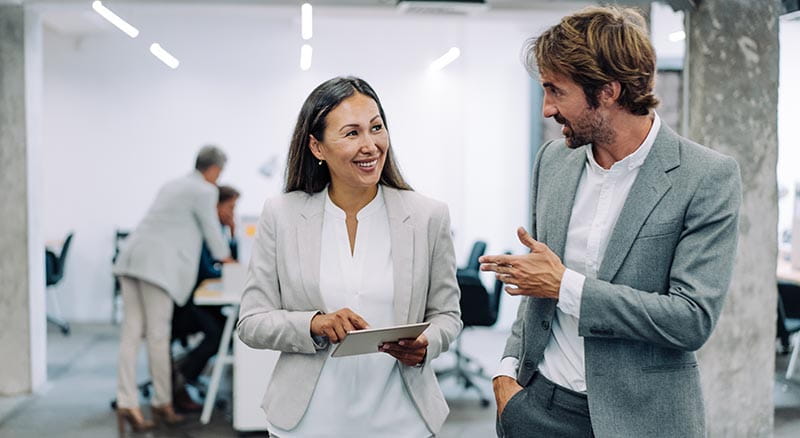 Colleagues in discussion in an office space