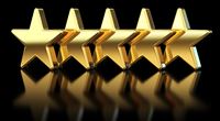 Five gold stars on a black background