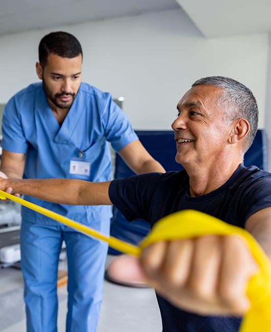 Person working on arm strength with doctor