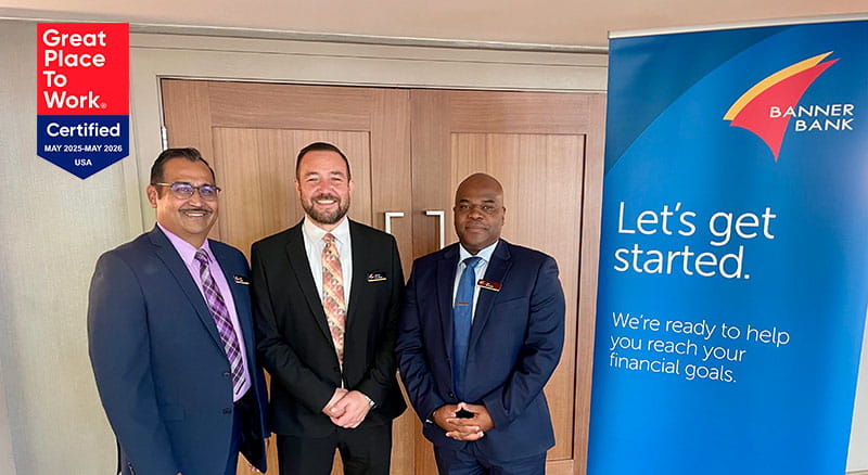 Banner employees next to a let's get started banner and a great place to work badge