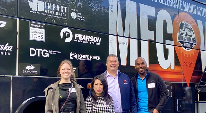 Banner team with AWB manufacturing week bus