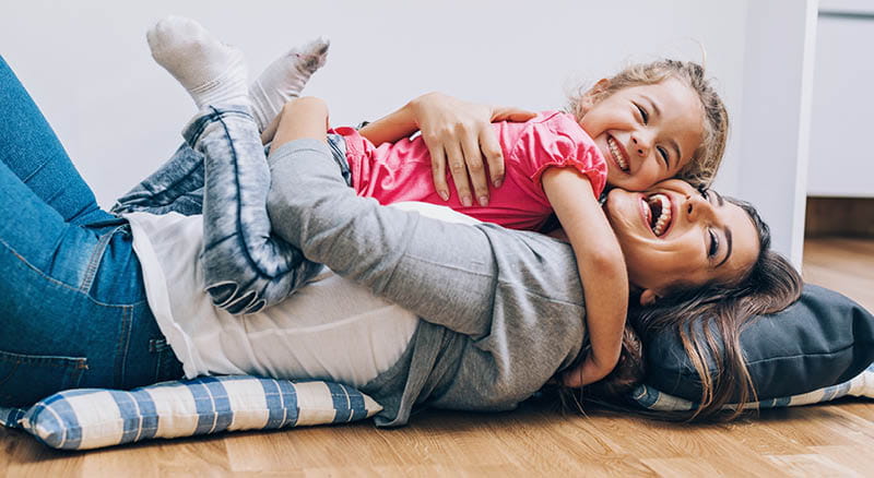 Mother and daughter cuddling