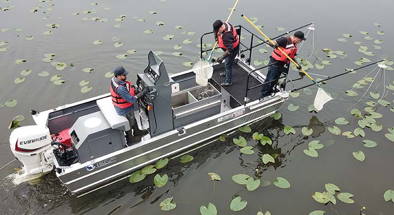 Electrofishing boat and people electrofishing
