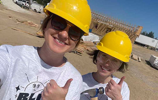 Two Banner Bank volunteers at a Habitat for Humanity blitz build