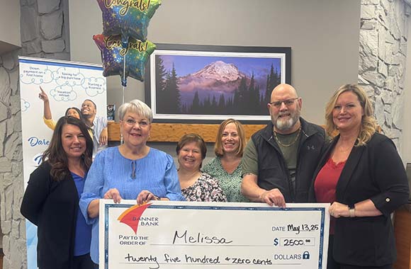 Dream big monthly winner check presentation