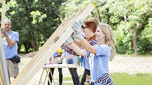 Volunteers framing a home