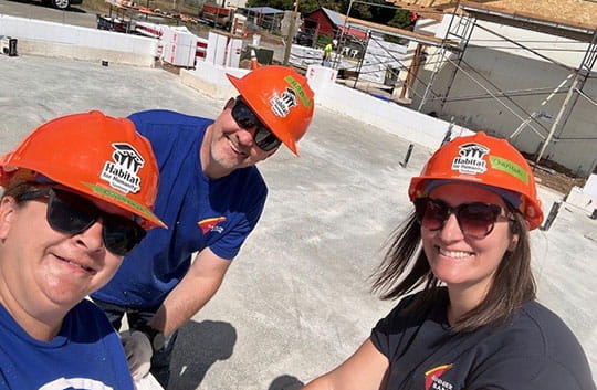 Three Banner Bank employees volunteer at the 2025 Spokane Habitat for Humanity Blitz Build