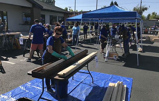 Banner Bank team member in the beginning stages of building a bunk bed.