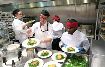 Students plate meals at Goodwill Chef's Dinner