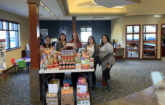 Members of our Twin Falls Branch showing what they collected for our annual food drive.