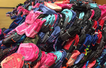Pile of new kids backpacks