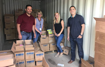 Banner employees donate time filling backpacks for kids