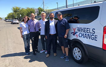 Members of our San Diego team stand with Wheels of Change and Alpha Project leaders in the effort to help the community’s homeless population.