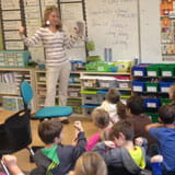 Banner Bank employee teaches elementary students about financial literacy.