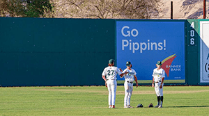 Pippins playing baseball in outfield