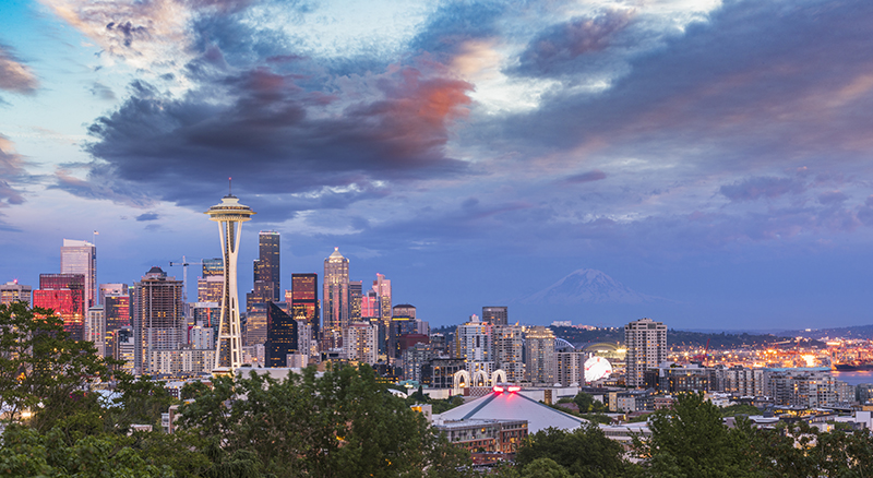 Seattle skyline with scattered clouds at sunset