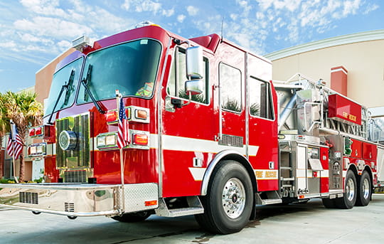 Banner Bank financed city fire truck sitting in front of a fire house