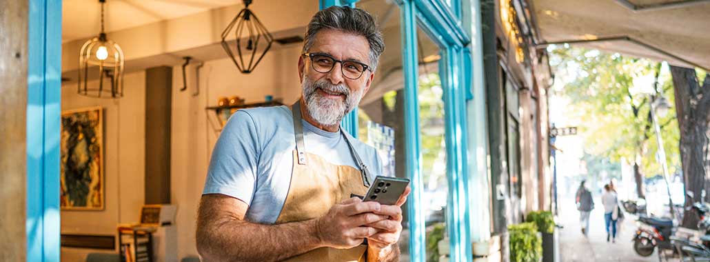 person on phone in shop doorway
