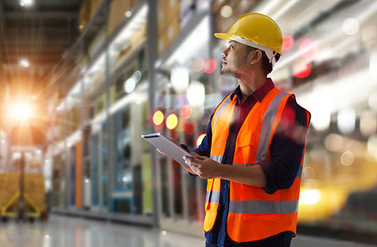 Person in warehouse on tablet