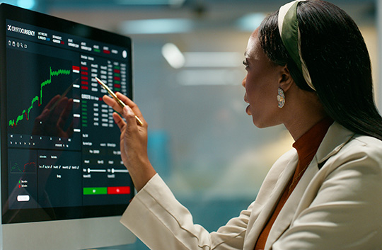 Person on computer in office looking at numbers
