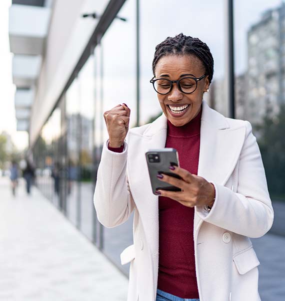 Happy person looking at a cell phone