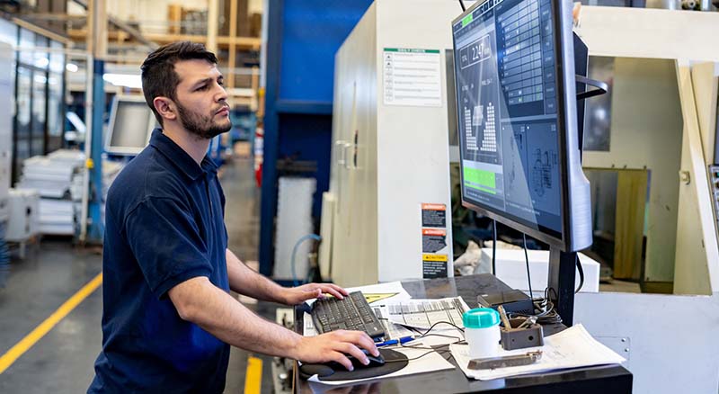 Person using a computer in a warehouse