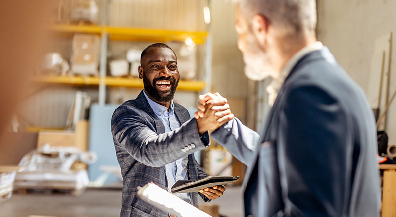 Two people exchanging handshaking