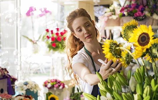 Flower shop owner with inventory