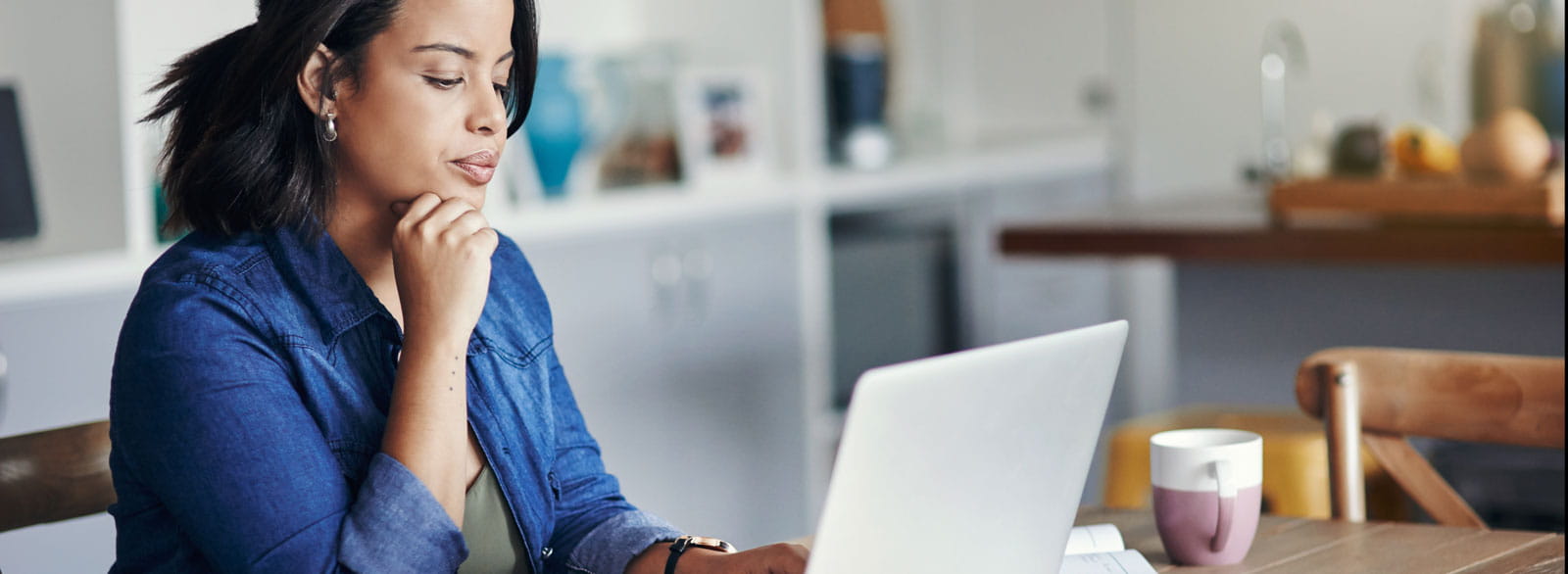 Woman checks her eStatements on a laptop using Banner Bank's online banking