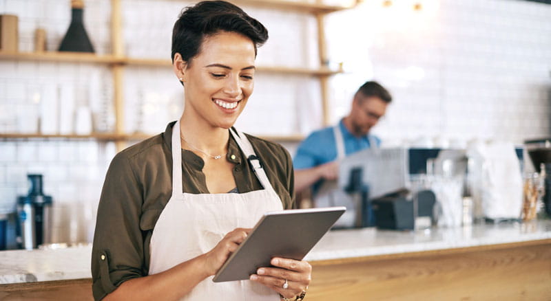 Coffee shop owner uses tablet to connect Banner Online Banking to her Intuit software