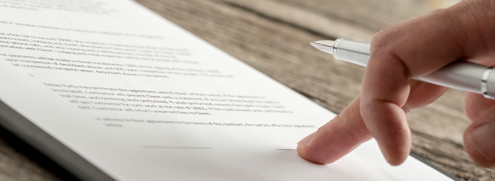 Close-up view of person looking at terms and conditions for online banking, bill pay, mobile banking, credit cards and debit cards