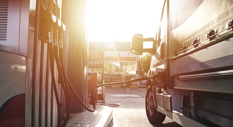 Semi truck refueling at gas station