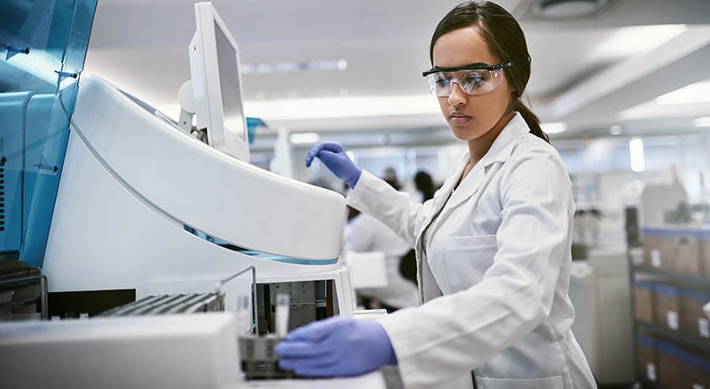 Medical worker using testing machine