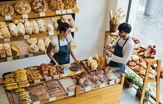 Two business partners manage a bakery