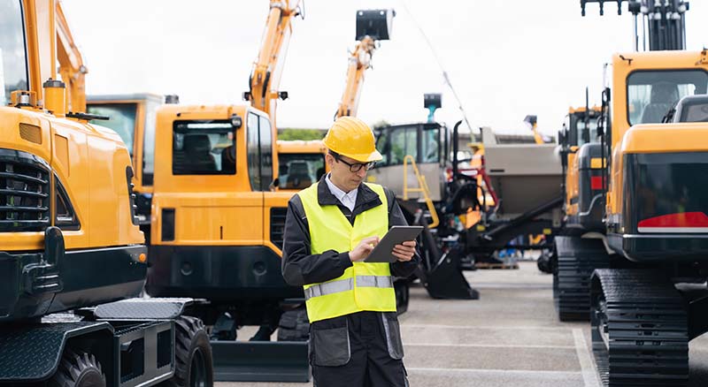 Row of parked yellow diggers