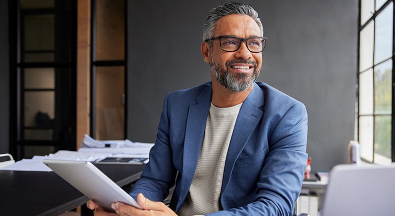 Person using tablet and smiling