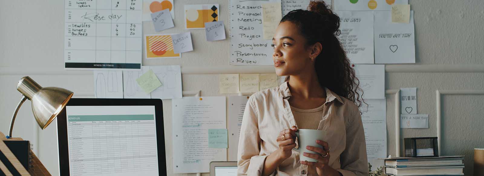 Business owner with a cup of coffee in office