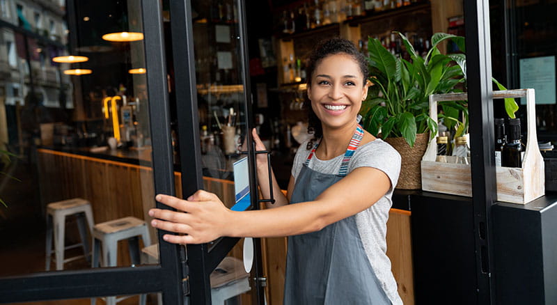 Shop owner opening doors for business