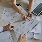 Person pointing at paperwork